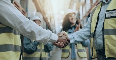 Handshake on a warehouse floor